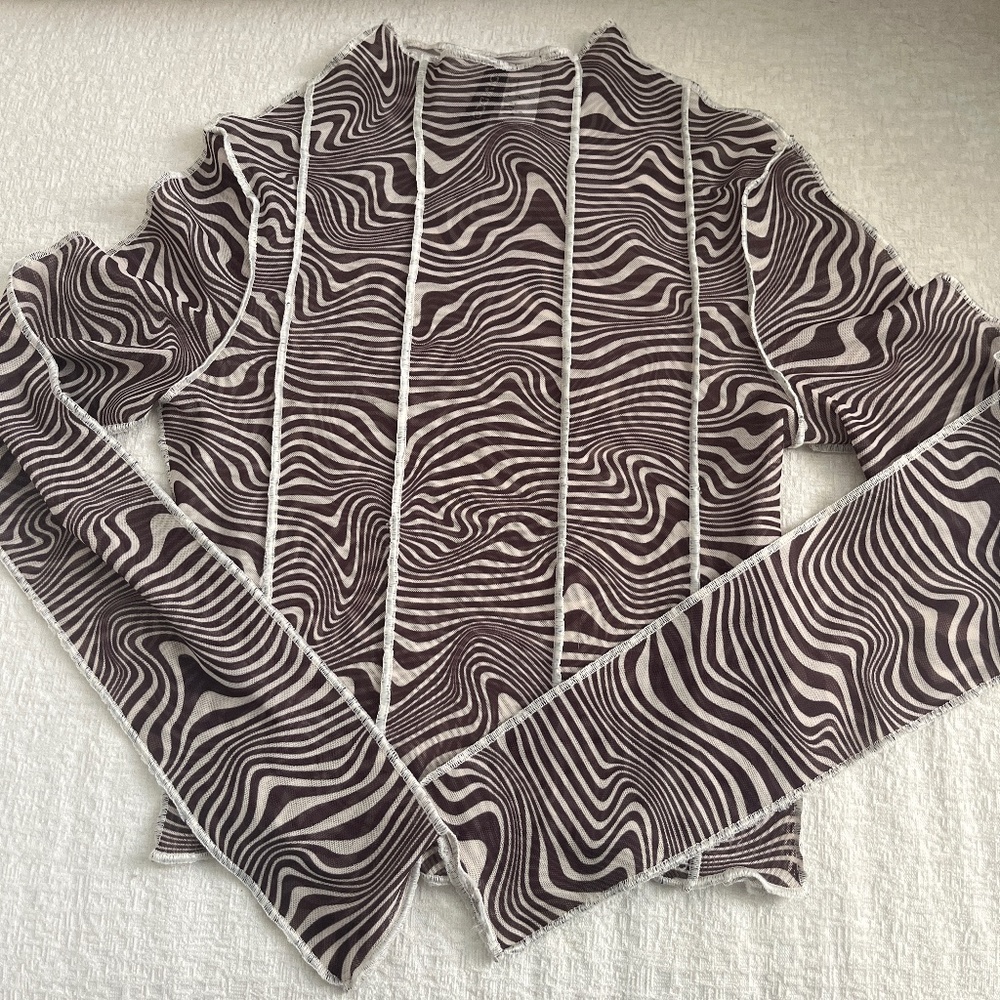 Sheer patterned top with white piping